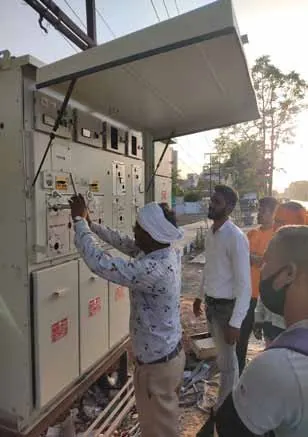 Technicians testing an electrical panel